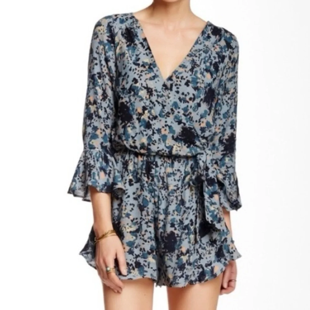 FREE PEOPLE “all the right ruffles” romper